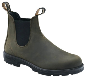 A slip-on ankle boot with dark green leather, black elastic side panels, and black pull tabs labeled "Tasmania Australia" and "Blundstone", featuring a thick, treaded black rubber sole.