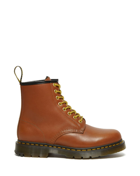 Brown leather ankle boot with yellow laces and sole stitching.