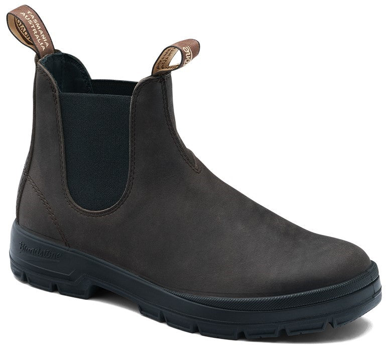 A dark brown leather Chelsea boot with elastic side panels, two pull-tabs, and a black lugged rubber sole, with "TASMANIA AUSTRALIA" visible on the back pull-tab.