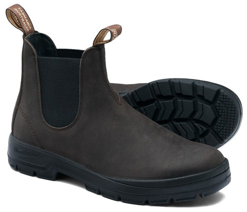 A dark brown leather Chelsea boot with black elastic side panels, a black lugged rubber sole, and two brown fabric pull tabs on the collar with the text Tasmania Australia.