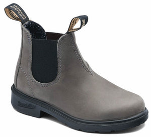 A gray leather Chelsea boot with black elastic side panels, a black lugged sole, and two fabric pull tabs at the top featuring visible text that reads Tasmania Australia.