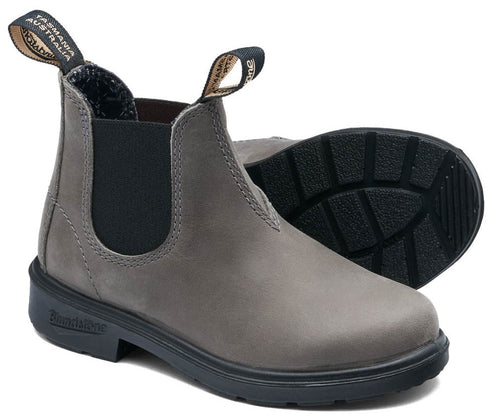 A gray leather Chelsea boot with black elastic side panels, black rubber lug soles, and two pull tabs on the collar that read "Tasmania Australia" and "Blundstone".