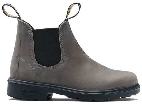 A gray leather Chelsea boot with dual pull tabs, black elastic side panels, and a thick black lug sole, viewed from the side.