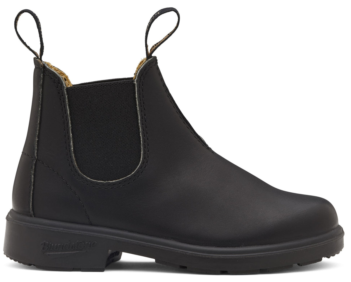 A black leather slip-on Chelsea boot with a thick rubber lug sole, elastic side panels, and two woven pull tabs at the top.