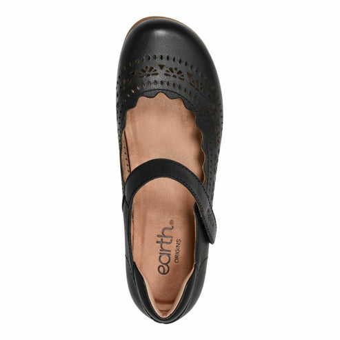 Black mary jane style shoe with die-cut detailing and hook and loop strap.