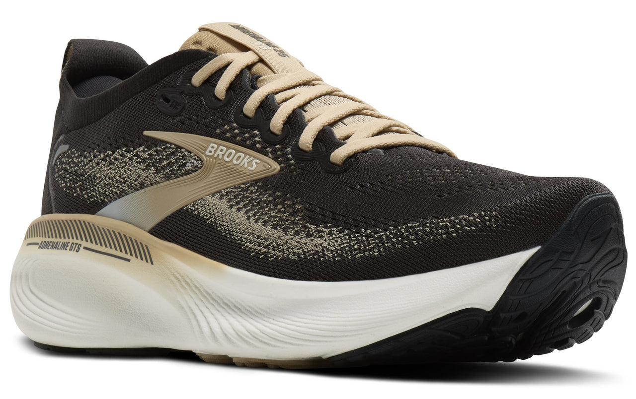 Black running shoe with gold accents, white midsole, and black outsole.