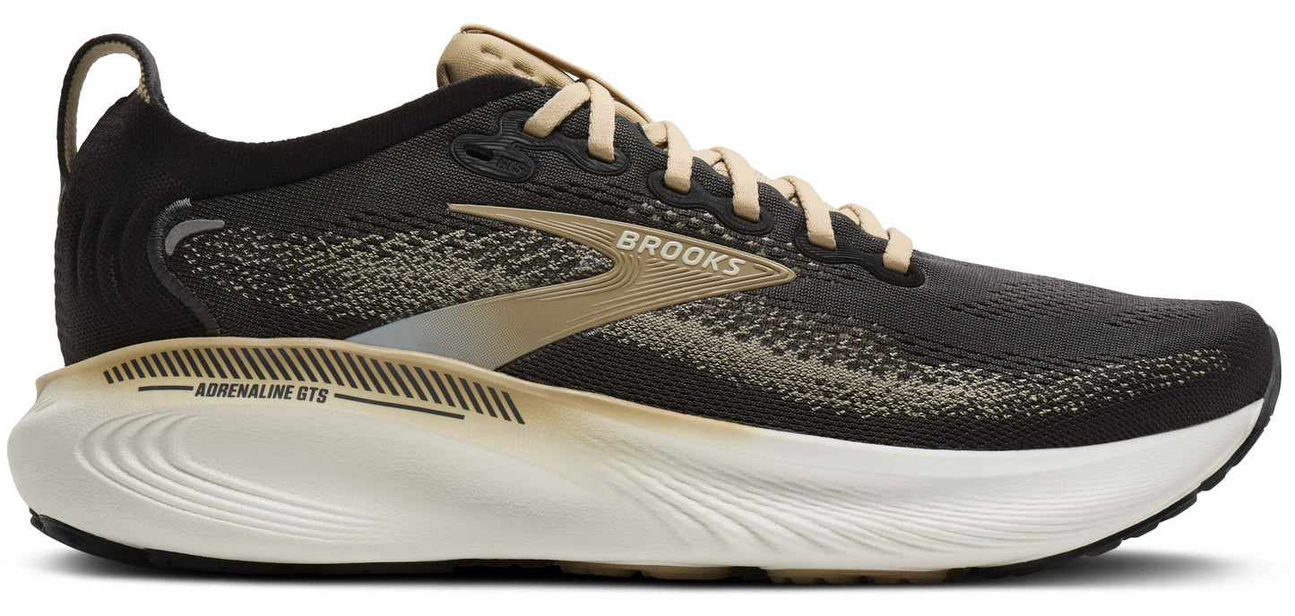 A running shoe in black with a tan logo and white sole.