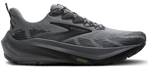 A gray running shoe with a curved sole.