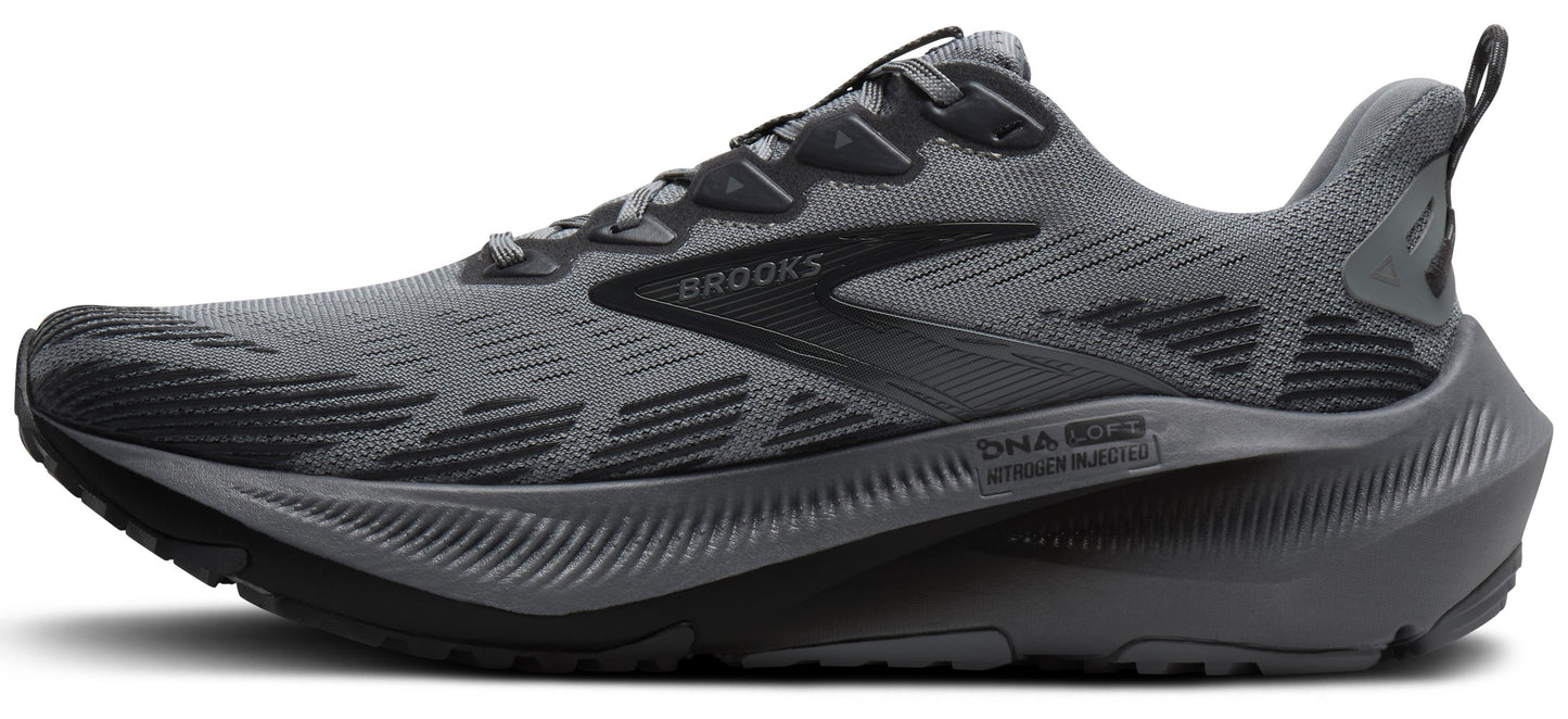 Gray running shoe with gray laces and a thick, black sole. The side of the shoe has a stylized BROOKS logo.