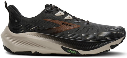 A running shoe with a black upper, a beige sole, and a brown logo that reads 'BROOKS' on the side.
