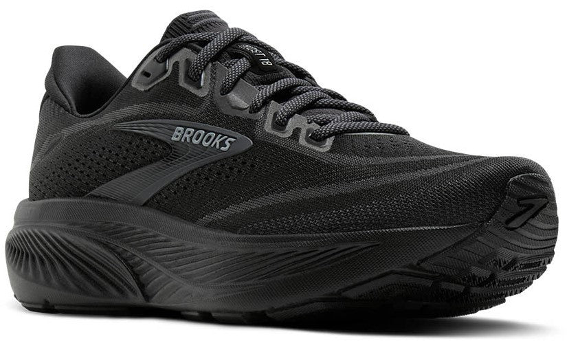 A running shoe in all black with laces and a thick sole.