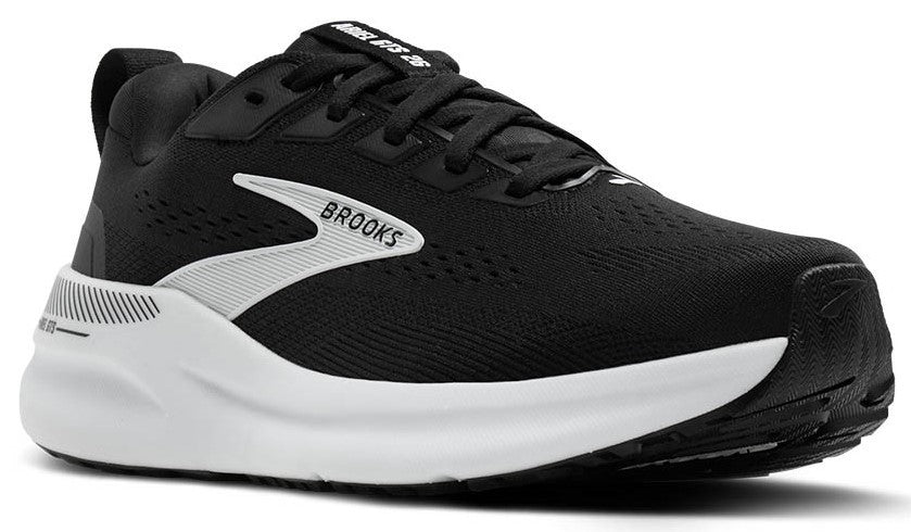 Black athletic shoe with white sole and white logo.