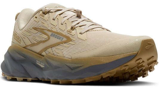 Tan running shoe with the word ARCADIA on the side.