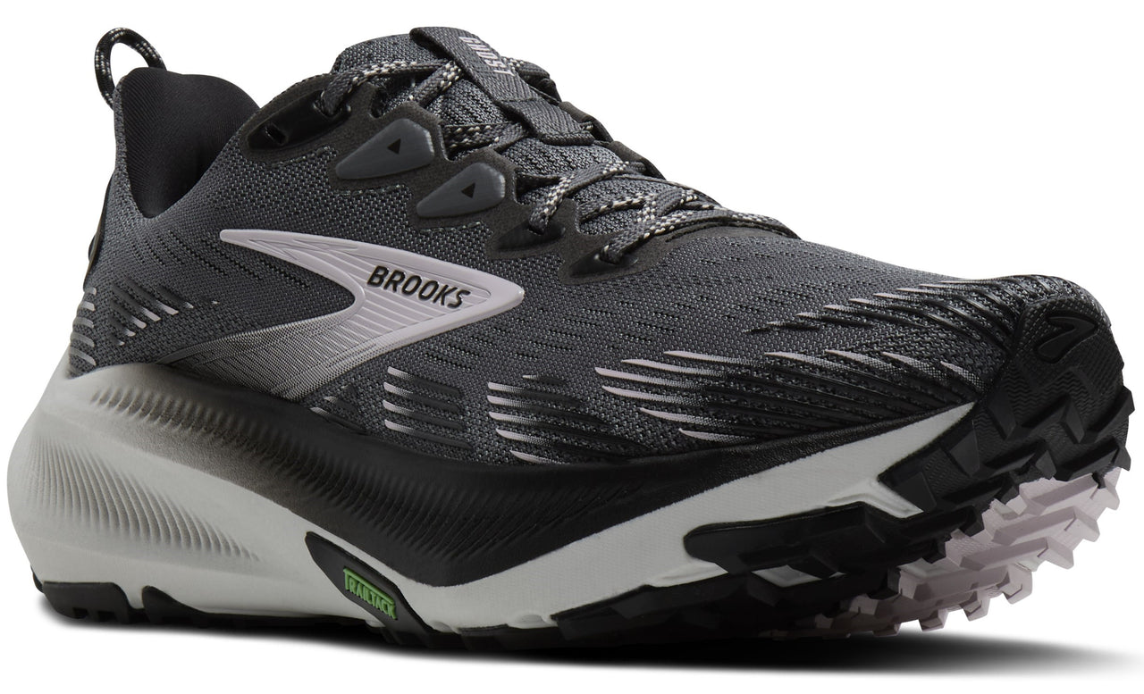 A gray and black running shoe with a white logo on the side.