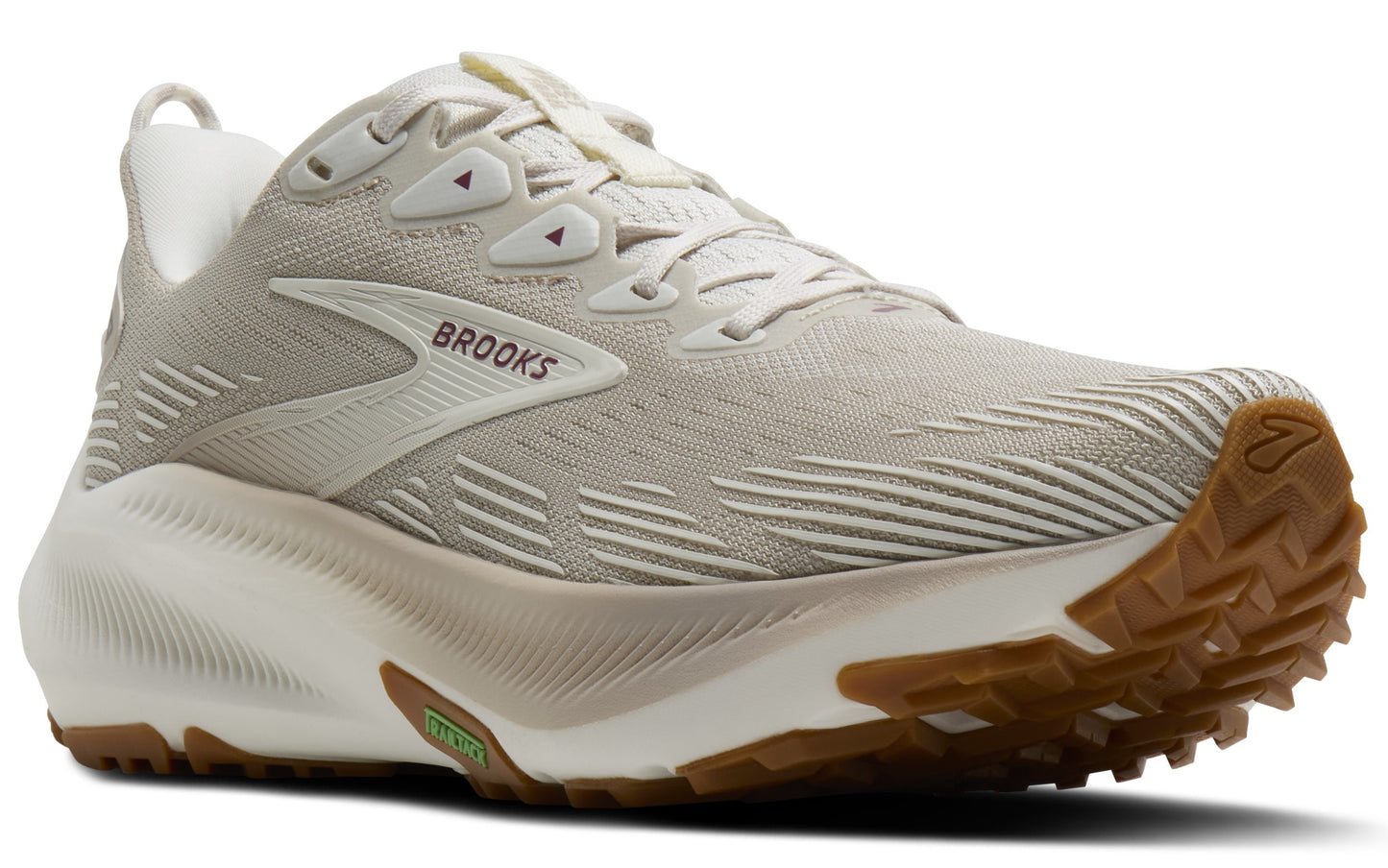 Beige running shoe with brown sole and the word "BROOKS" on the side.