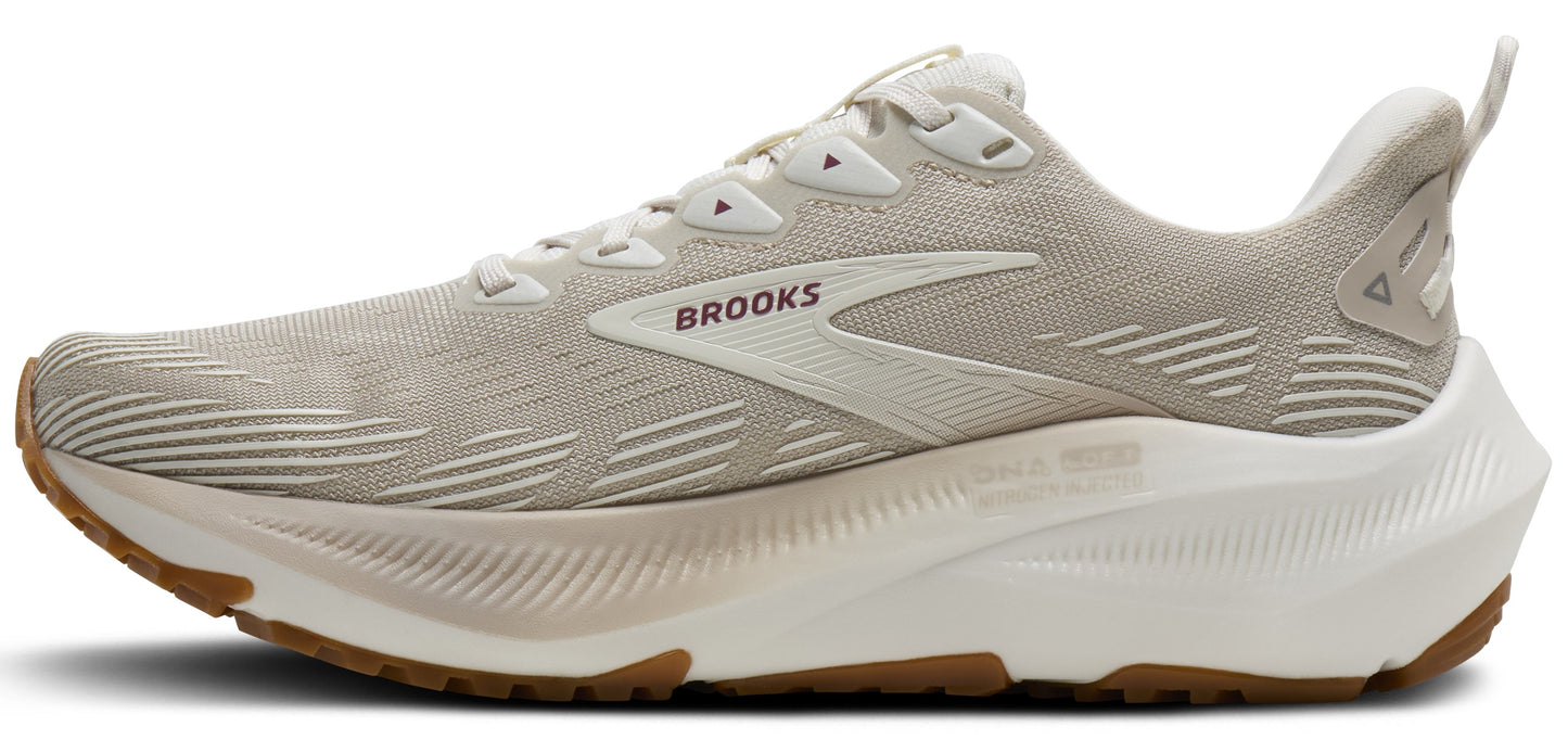Beige running shoe with a thick white sole and a brown rubber outsole.
