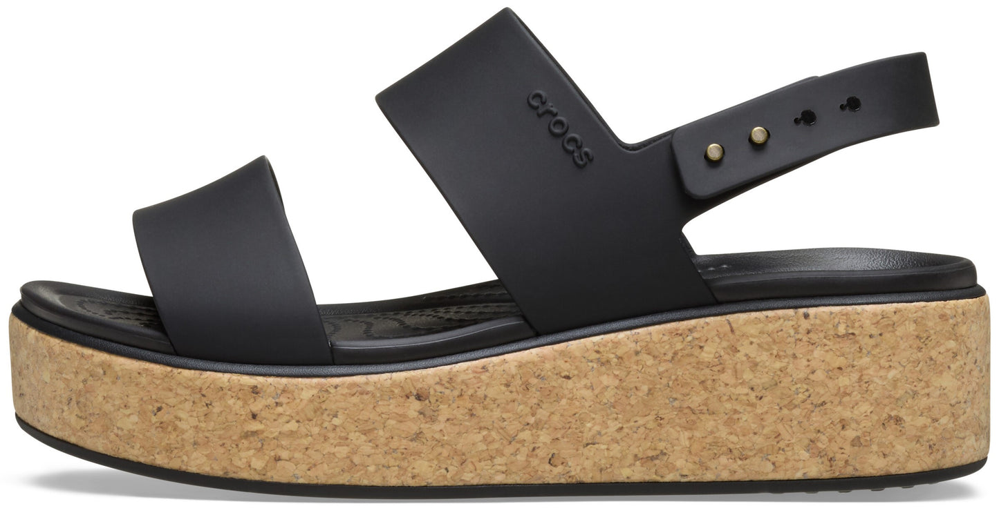 Black sandal with two wide straps, adjustable heel strap, and thick cork sole.