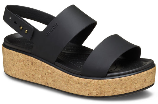 Black sandal with cork wedge heel and adjustable heel strap.