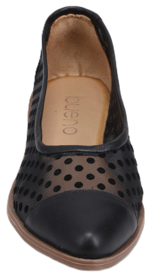 Black leather shoe with polka dot mesh panels.