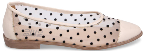 A flat shoe with a rounded toe and polka dot mesh.