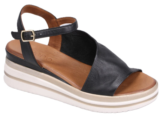 Black leather sandal with ankle strap and white platform sole.
