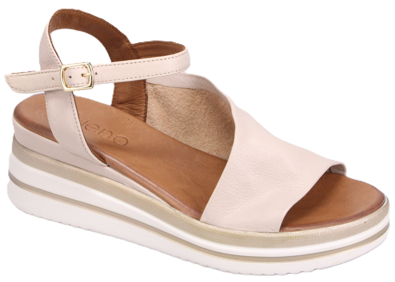 Beige sandal with an ankle strap and a layered white wedge sole.