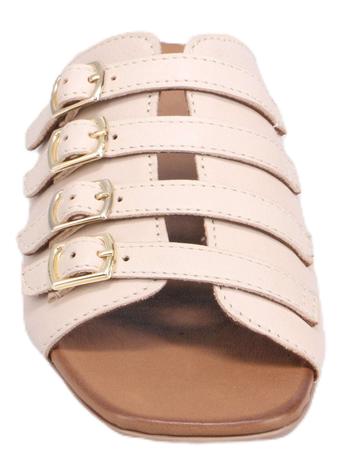 Beige flat sandal featuring three straps with gold buckles.