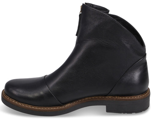 A black leather ankle boot with a rounded toe, a visible front zipper closure, and a low, stacked-look heel with tan stitching along the welt.