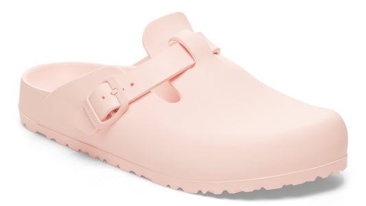 Light pink, unisex, slip-on clog with adjustable buckle strap.