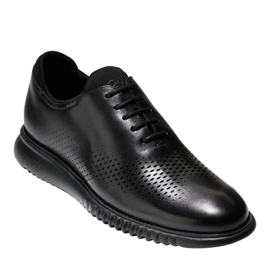 Black leather dress shoe with a perforated pattern on the front.