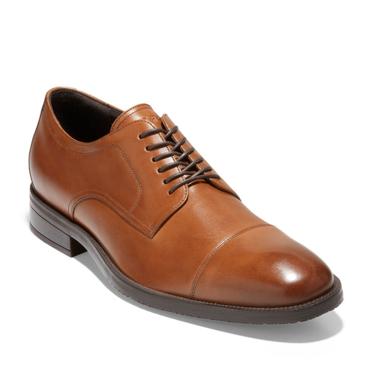 Cap-toe dress shoe, light brown leather, dark laces.