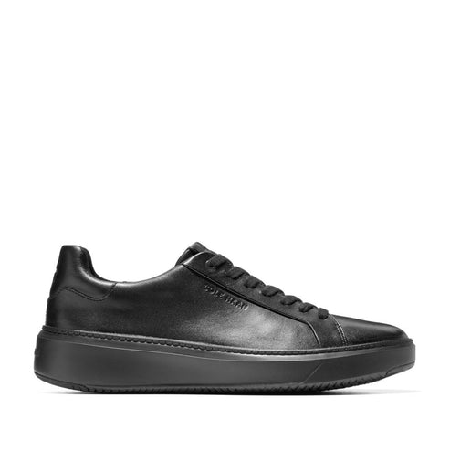 Black leather sneaker with a chunky, black sole.