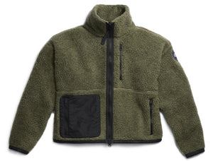 Olive green sherpa jacket with black pocket and zipper.