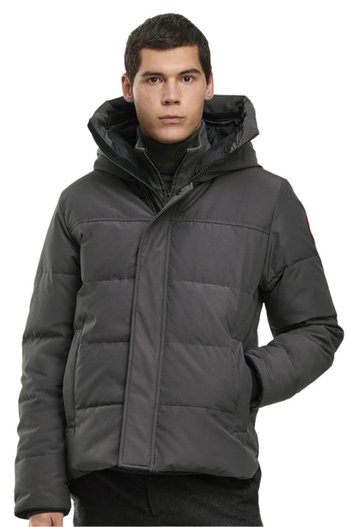 Man in charcoal puffer jacket with a hood.