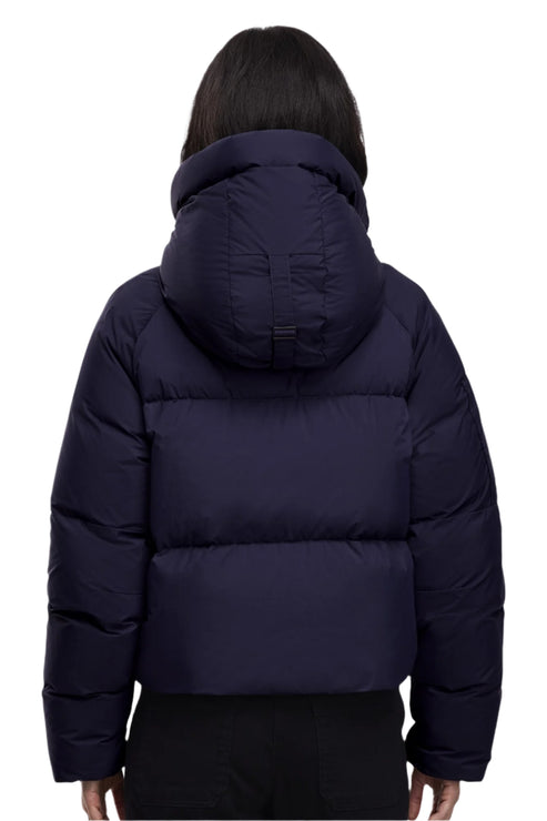 Back view of a dark blue puffer jacket with hood.