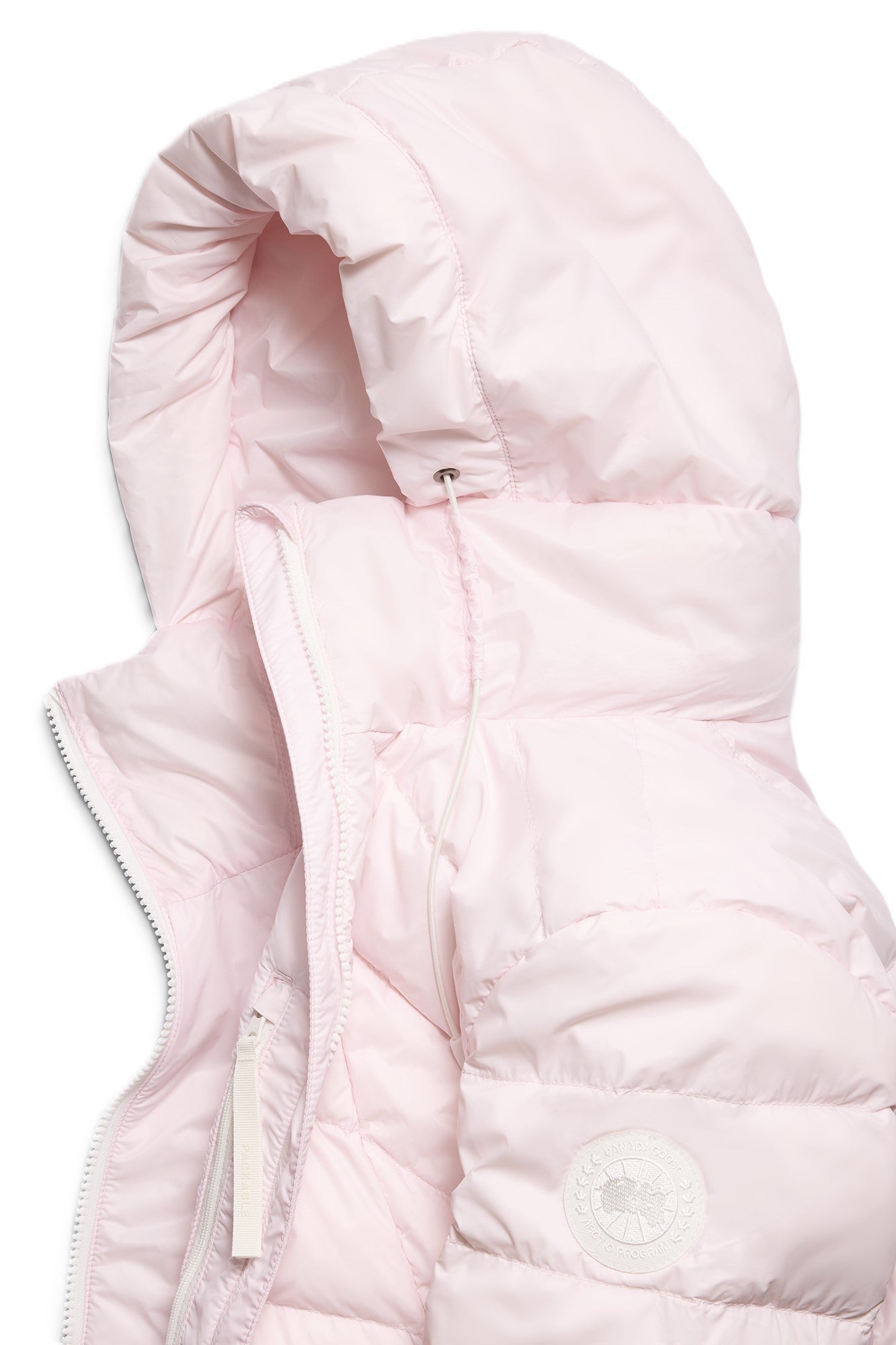 Close-up of a light pink hooded down jacket.