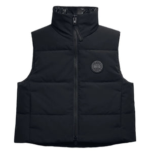 Black puffy vest with zippered front and a round logo on the right chest