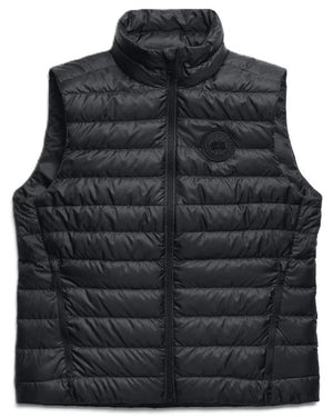 Black quilted vest with a zipper closure and a round logo on the chest.