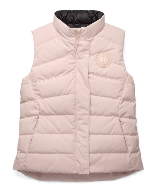 Light pink puffer vest with high collar.