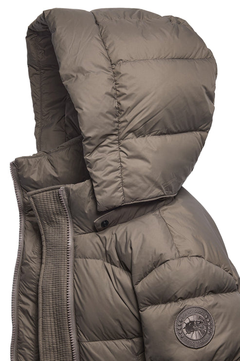 Close-up of a khaki-colored down jacket with a hood.