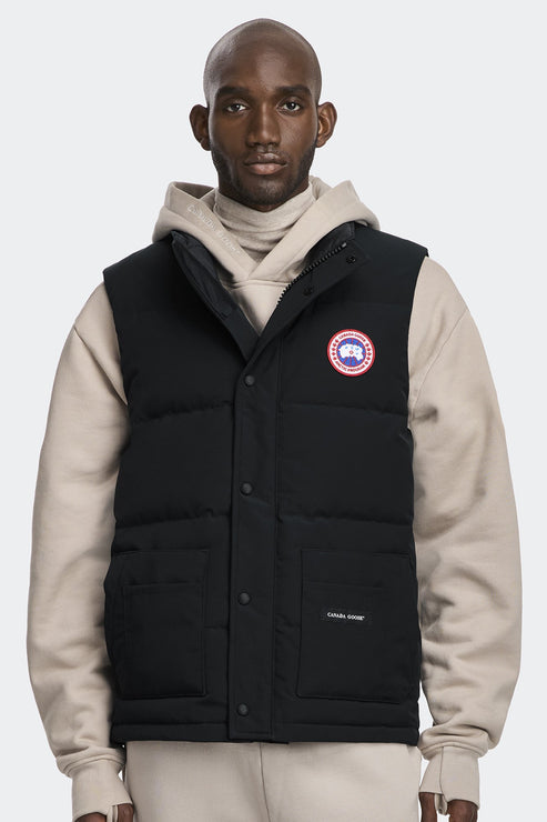 A Black vest with a circular logo on the upper-left and the text "CANADA GOOSE" on the lower-left.