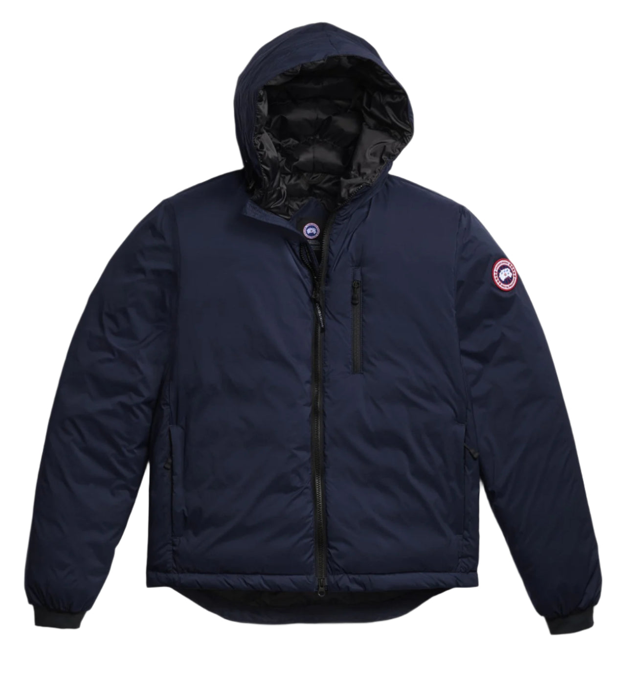 Navy blue hooded puffer jacket with a zipper closure and a circular emblem on the left arm.