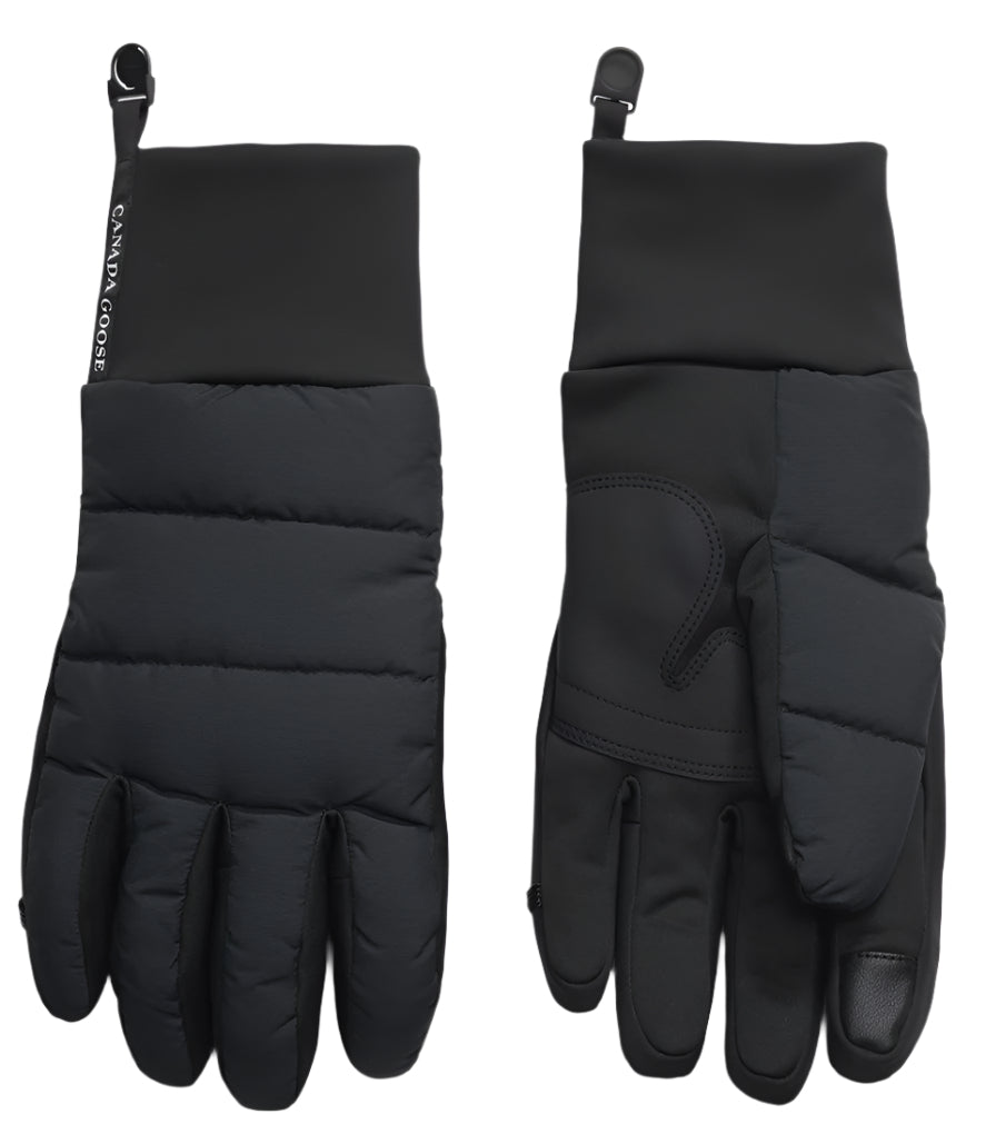 A pair of black winter gloves, one showing the padded top and the other showing the palm, with a logo that says "CANADA GOOSE".