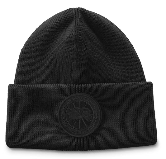 Black beanie with circular logo on the front.