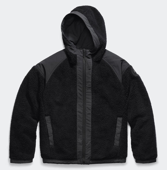 Black fleece hooded jacket with dark nylon trim.