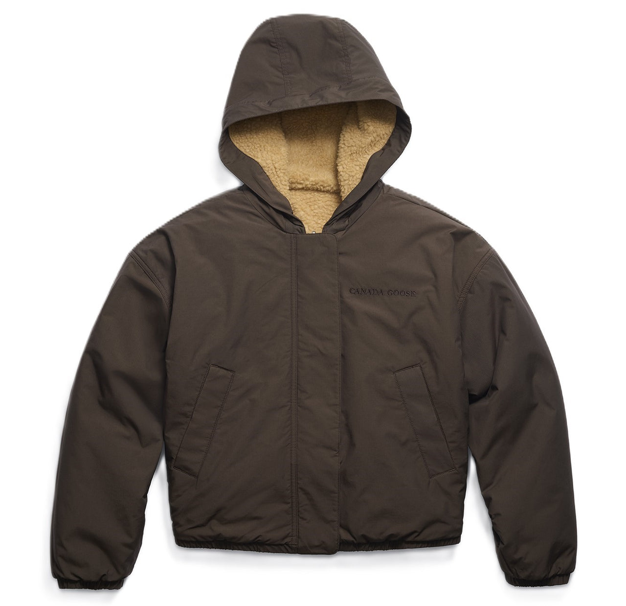 Brown hooded jacket with SHERPA lining and a dark inscription.