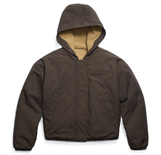 Brown hooded jacket with SHERPA lining and a dark inscription.