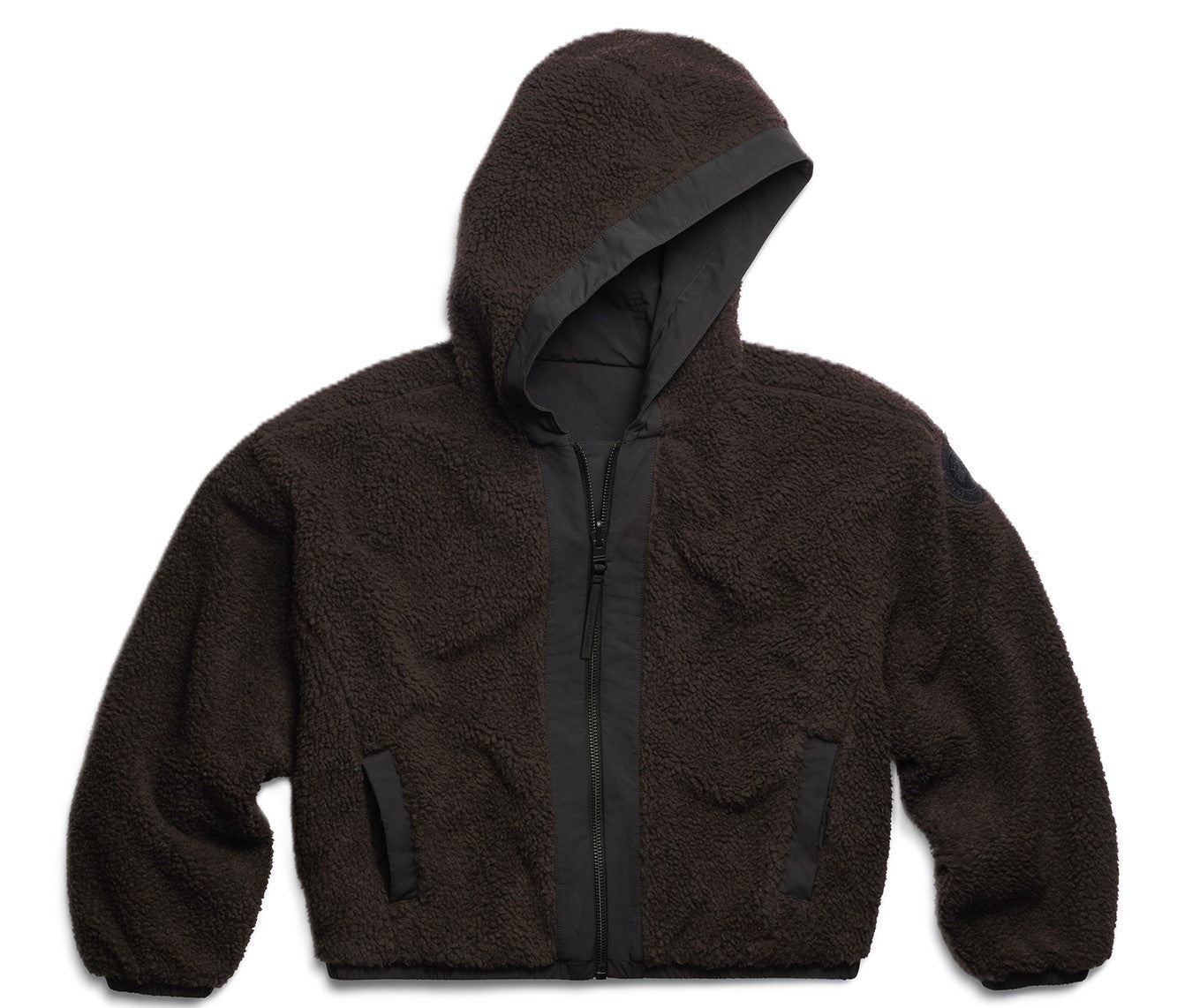 A dark brown, hooded, zip-up, loose-fit, plush fleece jacket.