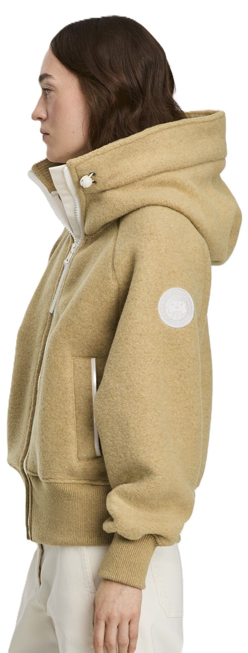 A light brown hooded jacket with white accents.