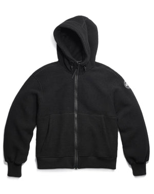 Black hooded zip-up sweatshirt with kangaroo pocket and logo patch on the right sleeve.